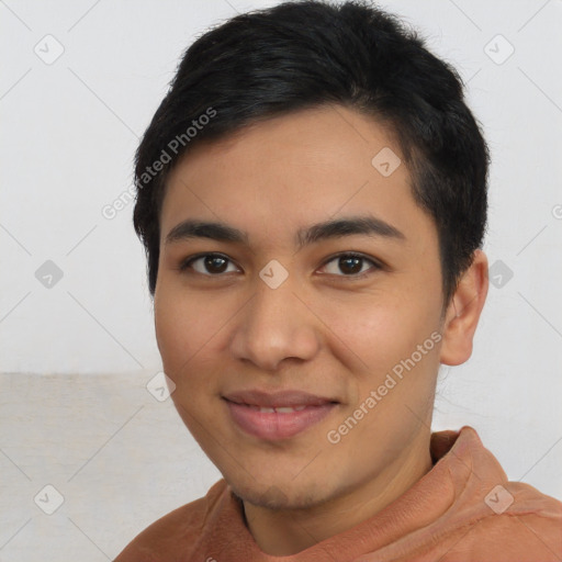 Joyful latino young-adult male with short  black hair and brown eyes