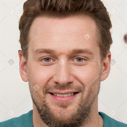 Joyful white adult male with short  brown hair and grey eyes