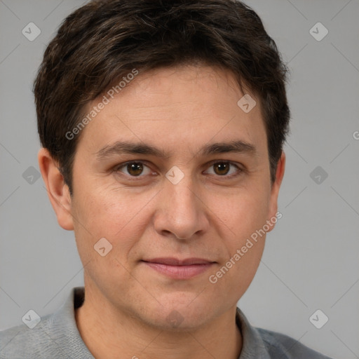 Joyful white adult male with short  brown hair and brown eyes