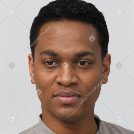 Joyful black young-adult male with short  black hair and brown eyes