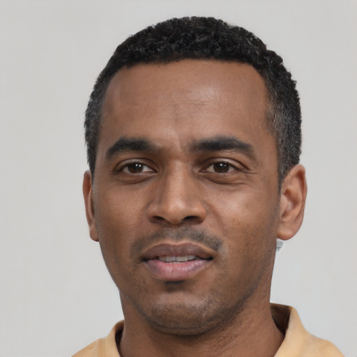 Neutral black young-adult male with short  black hair and brown eyes