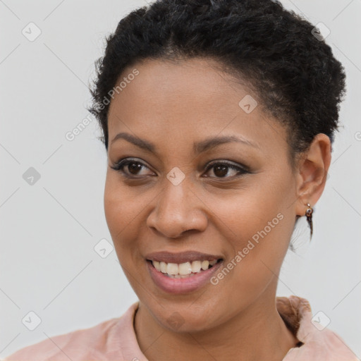 Joyful latino young-adult female with short  brown hair and brown eyes