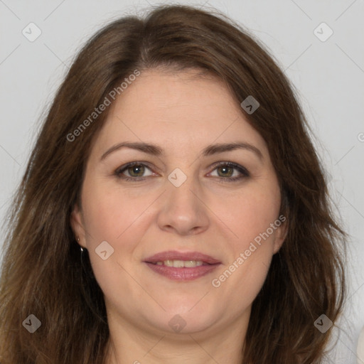 Joyful white adult female with long  brown hair and brown eyes