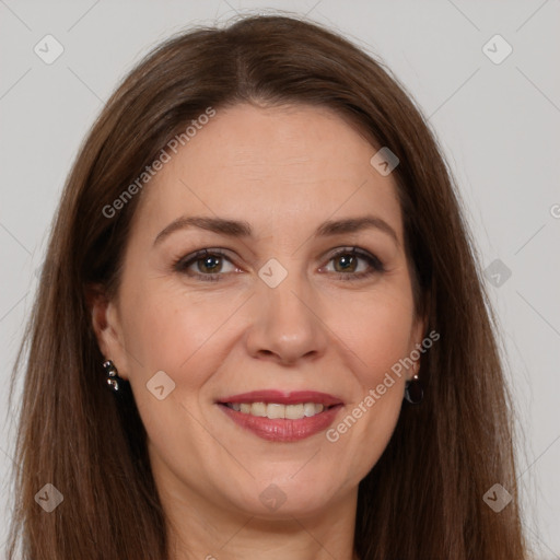 Joyful white adult female with long  brown hair and brown eyes