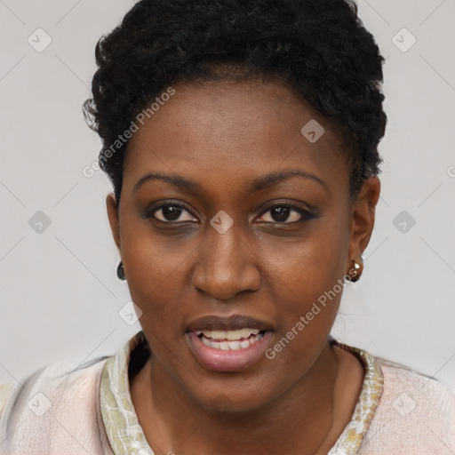 Joyful black young-adult female with short  brown hair and brown eyes