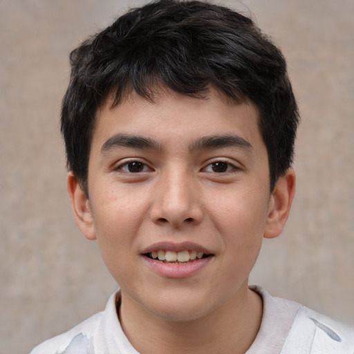 Joyful white child male with short  brown hair and brown eyes
