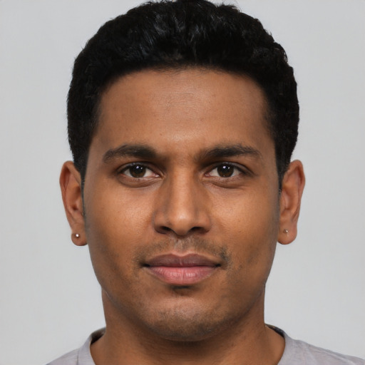 Neutral latino young-adult male with short  black hair and brown eyes