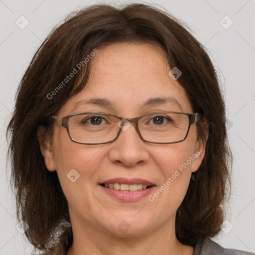 Joyful white adult female with medium  brown hair and grey eyes