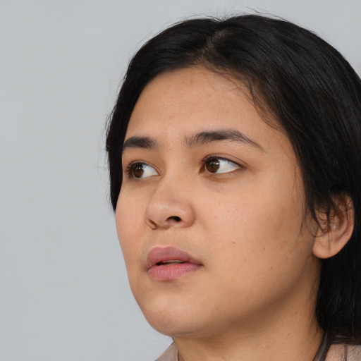Neutral asian young-adult female with medium  black hair and brown eyes