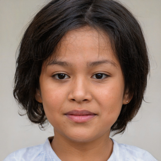 Joyful white child female with medium  brown hair and brown eyes