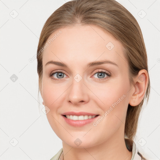 Joyful white young-adult female with medium  brown hair and blue eyes