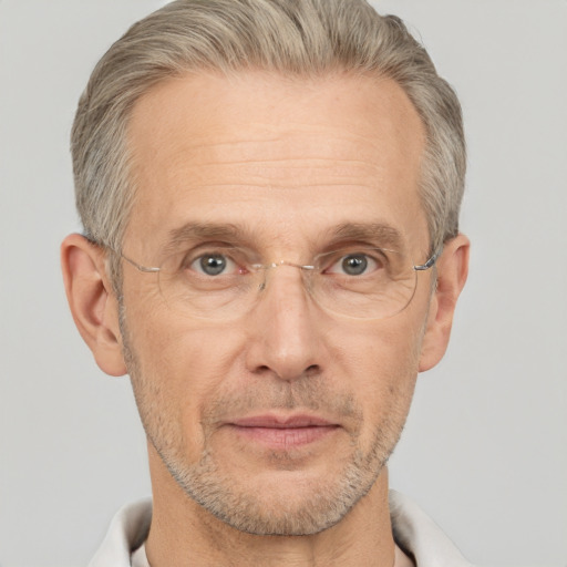 Neutral white middle-aged male with short  gray hair and brown eyes