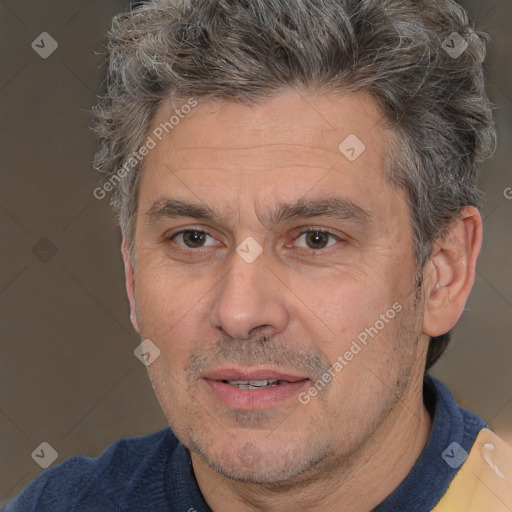 Joyful white middle-aged male with short  brown hair and brown eyes