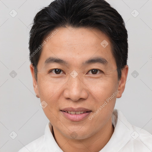 Joyful white adult male with short  brown hair and brown eyes