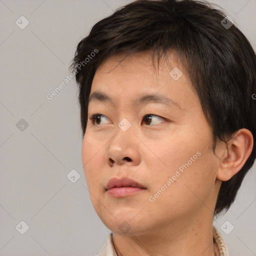 Neutral asian adult female with short  brown hair and brown eyes