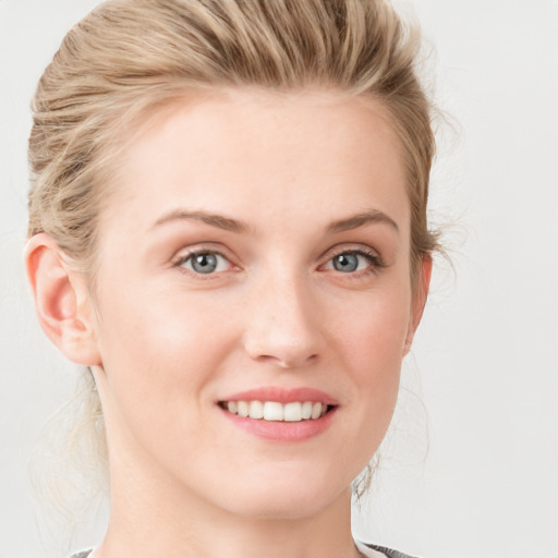 Joyful white young-adult female with medium  brown hair and blue eyes