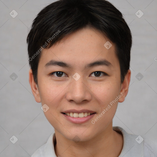 Joyful asian young-adult female with short  brown hair and brown eyes