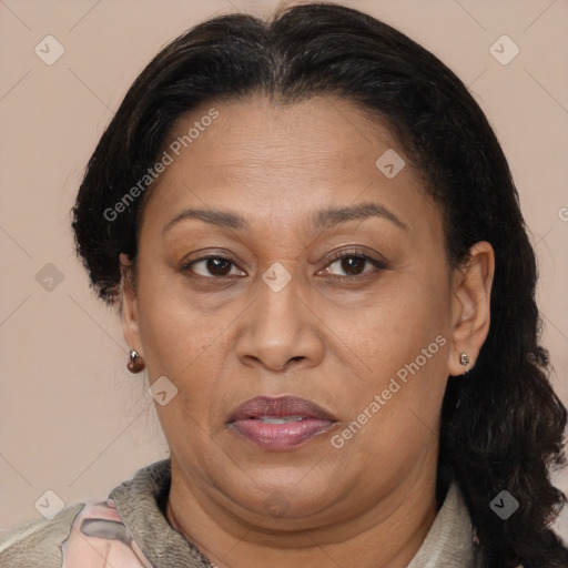Joyful latino adult female with medium  brown hair and brown eyes