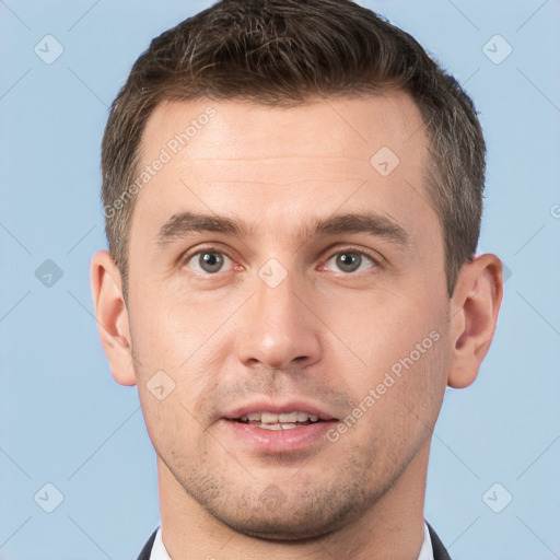 Neutral white young-adult male with short  brown hair and grey eyes