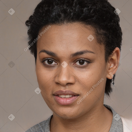 Joyful black young-adult female with short  black hair and brown eyes