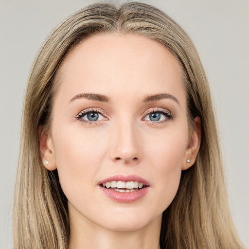 Joyful white young-adult female with long  brown hair and blue eyes