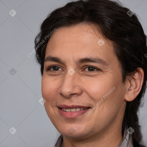 Joyful white adult male with medium  brown hair and brown eyes