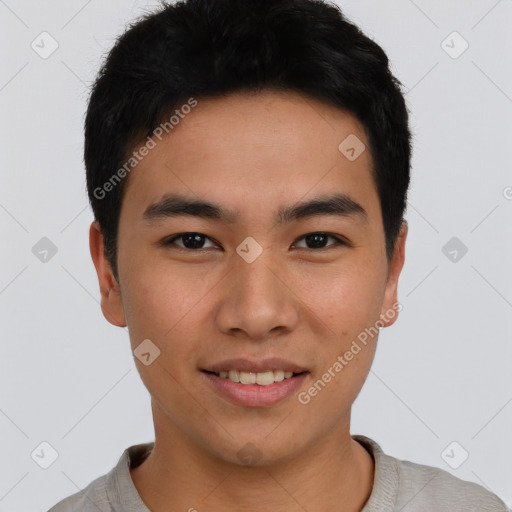 Joyful asian young-adult male with short  black hair and brown eyes