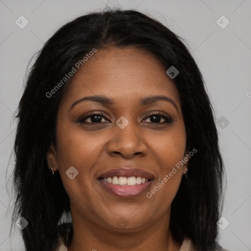 Joyful black young-adult female with long  brown hair and brown eyes