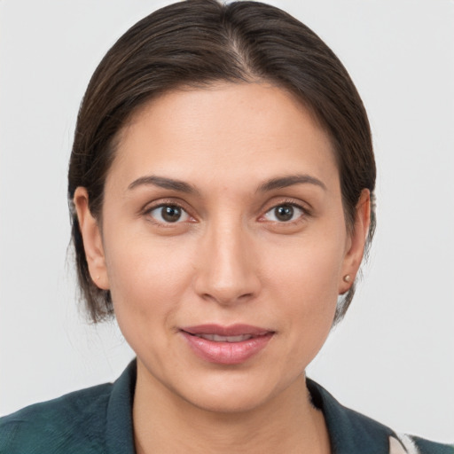 Joyful white young-adult female with medium  brown hair and brown eyes