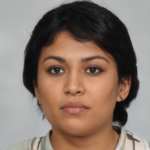 Neutral latino young-adult female with medium  black hair and brown eyes