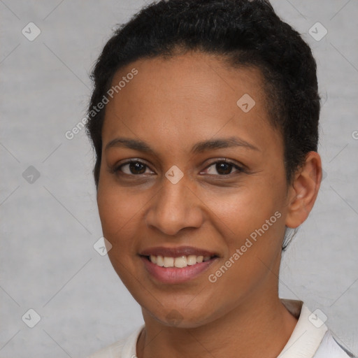 Joyful latino young-adult female with short  brown hair and brown eyes