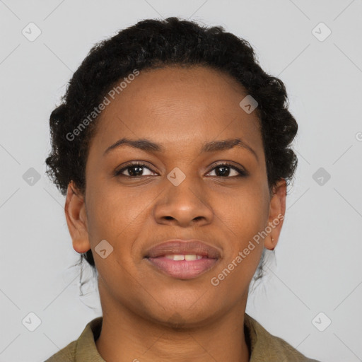 Joyful black young-adult female with short  brown hair and brown eyes