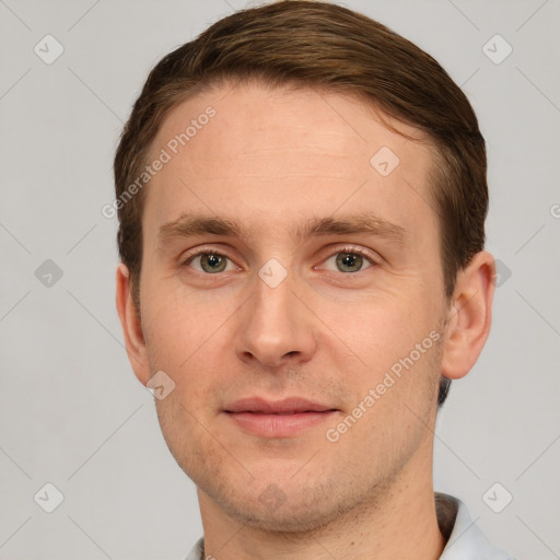 Joyful white young-adult male with short  brown hair and grey eyes