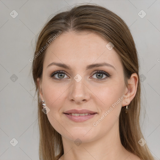 Joyful white young-adult female with medium  brown hair and green eyes