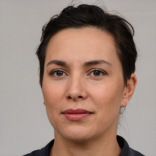 Joyful white adult female with short  brown hair and brown eyes