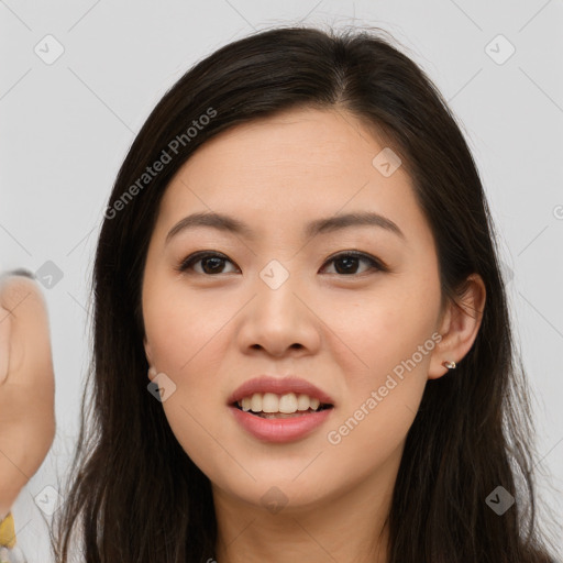 Joyful asian young-adult female with long  brown hair and brown eyes