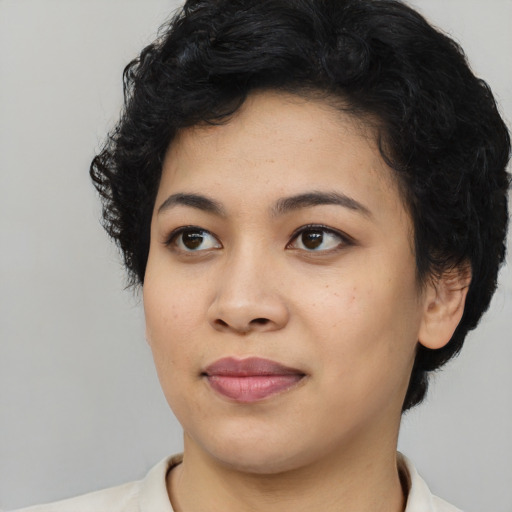 Joyful asian young-adult female with medium  black hair and brown eyes