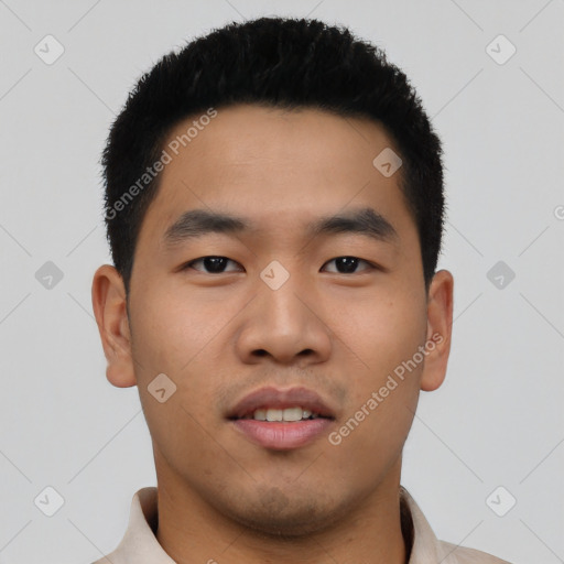 Joyful asian young-adult male with short  black hair and brown eyes