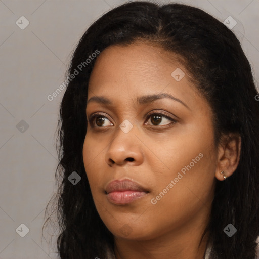 Neutral black young-adult female with long  brown hair and brown eyes