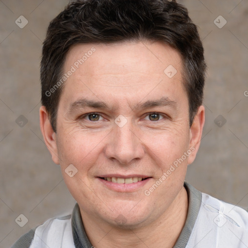 Joyful white adult male with short  brown hair and brown eyes