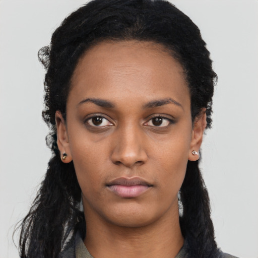 Neutral black young-adult female with long  black hair and brown eyes