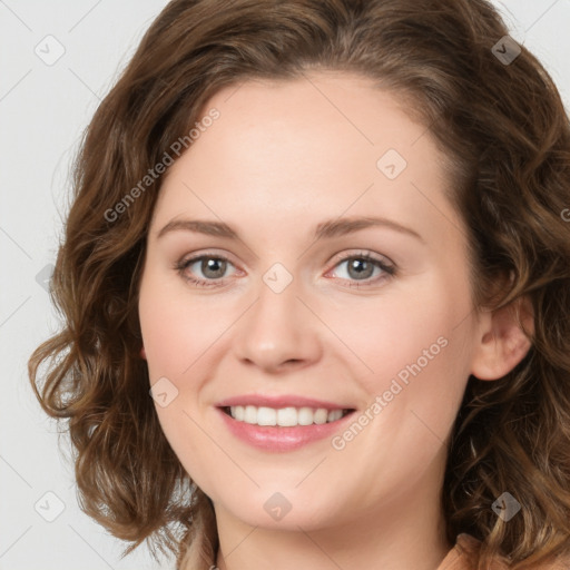 Joyful white young-adult female with long  brown hair and green eyes