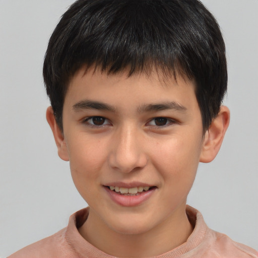 Joyful white child male with short  brown hair and brown eyes