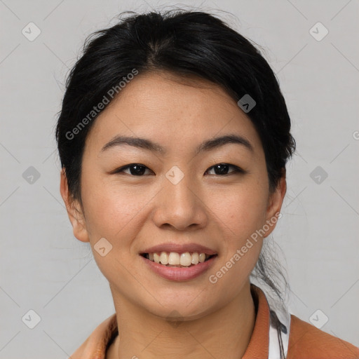 Joyful asian young-adult female with short  black hair and brown eyes