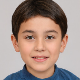 Joyful white child male with short  brown hair and brown eyes