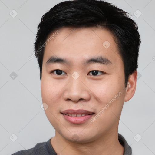 Joyful white young-adult male with short  black hair and brown eyes