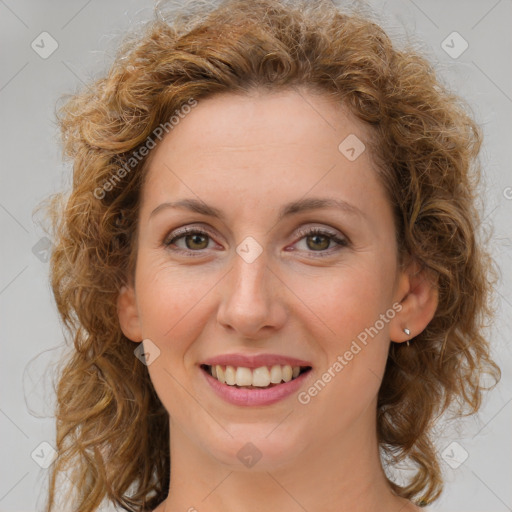 Joyful white young-adult female with medium  brown hair and green eyes