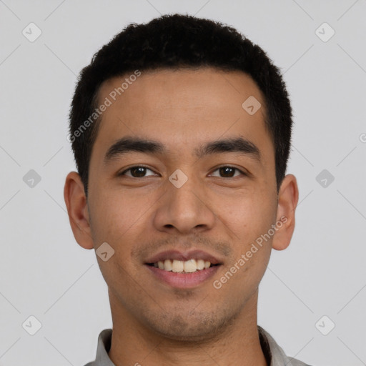 Joyful latino young-adult male with short  black hair and brown eyes