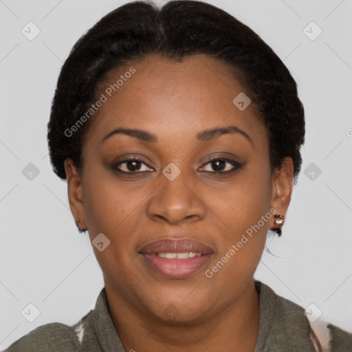 Joyful black young-adult female with short  brown hair and brown eyes