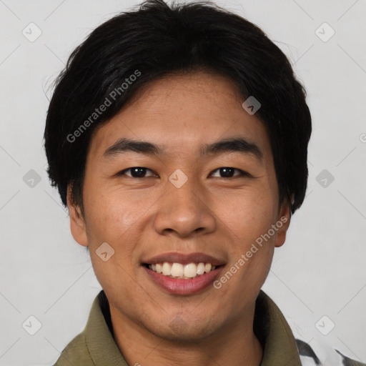 Joyful asian young-adult male with short  black hair and brown eyes